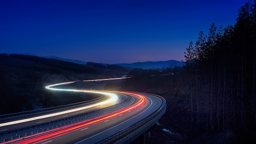 A long exposure of a highway at night. 